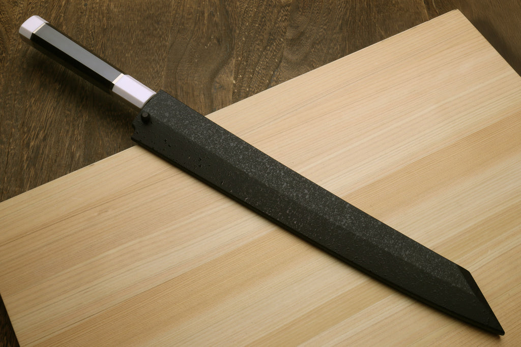 Japanese sushi knife with dark ebony handle and straight steel blade, pointed tip