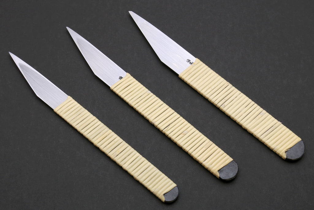 Three kiridashi utility knives with beige handles and silver blades