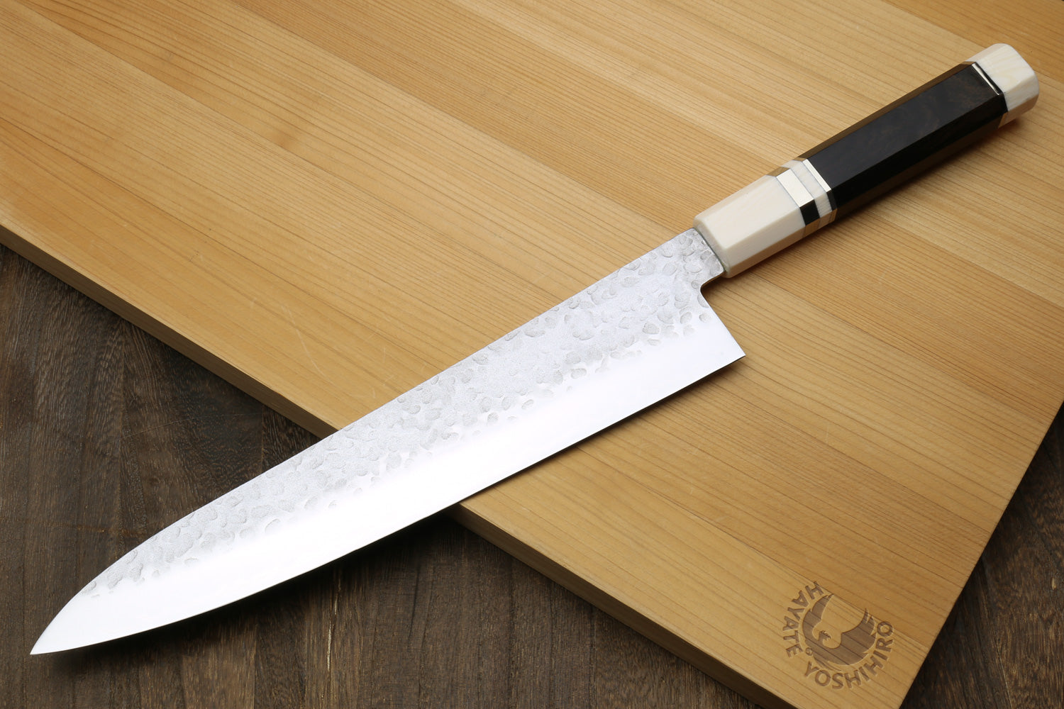 Gyuto chef knife with hammered stainless blade and black ebony handle, ivory bolster