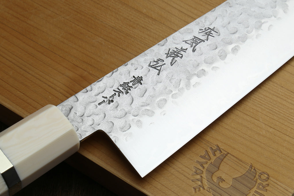 Gyuto chef knife with hammered stainless blade and ebony wood handle, ivory bolster