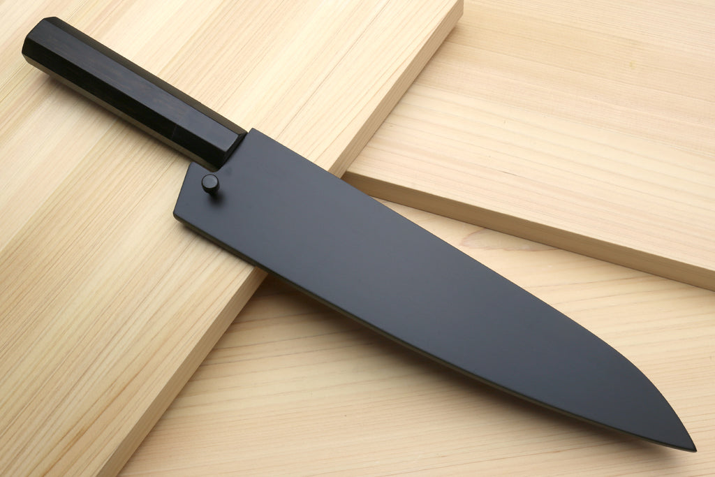 Hammered stainless gyuto chef's knife with ebony handle and dark sheath view