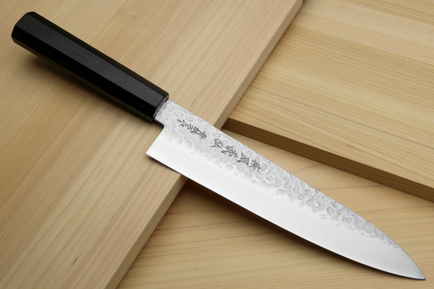 Hammered stainless gyuto chef's knife with ebony handle, exposed blade