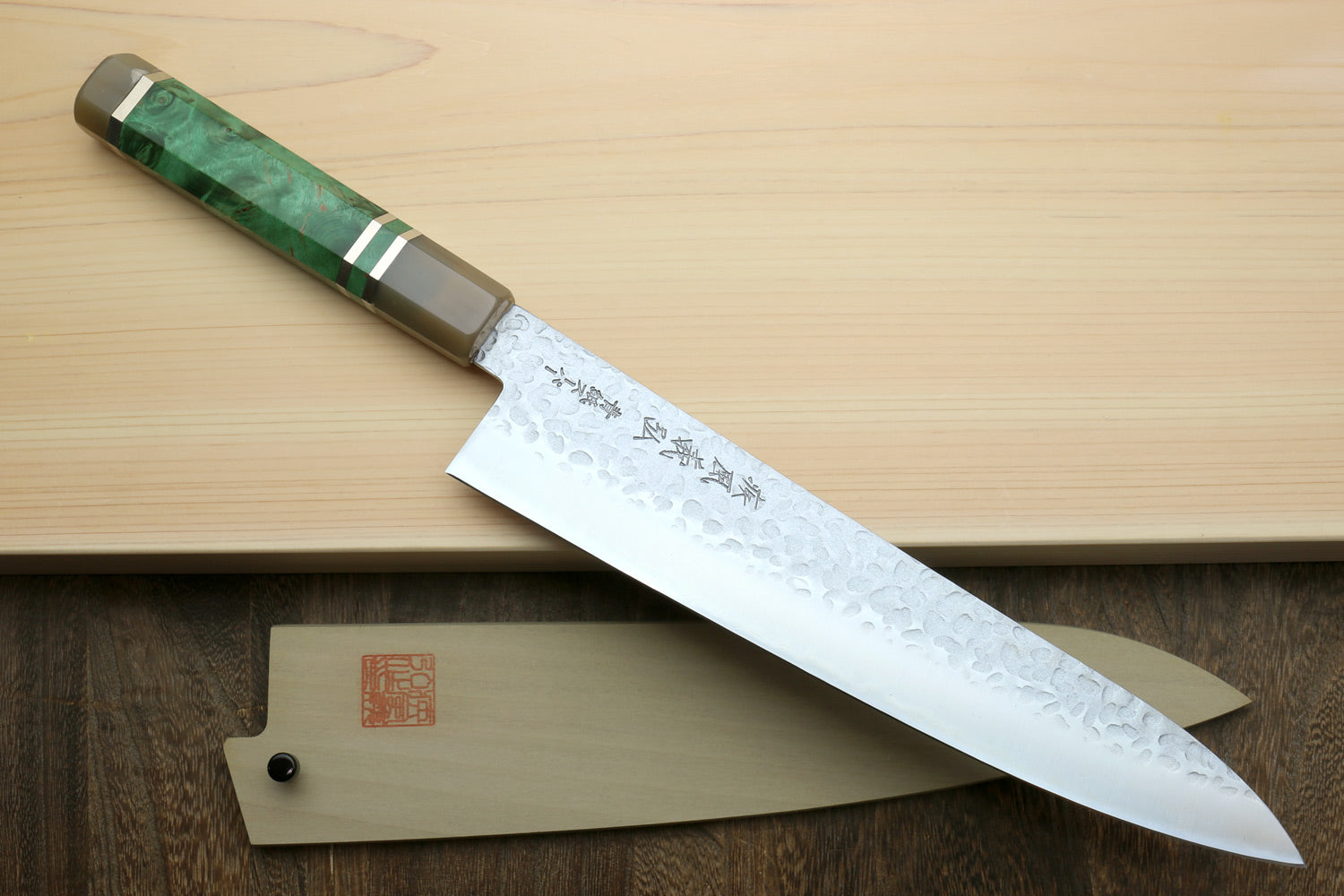 Gyuto chef knife with hammered stainless blade and green stabilised handle