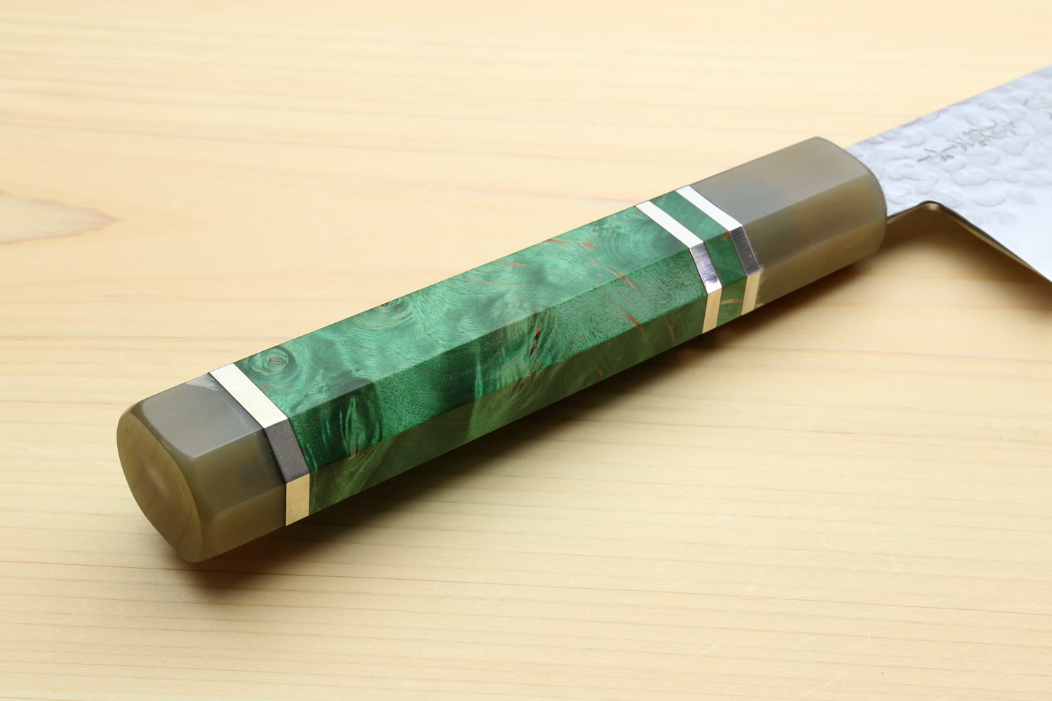 Gyuto chef knife handle with green stone wrap and silver ring accents
