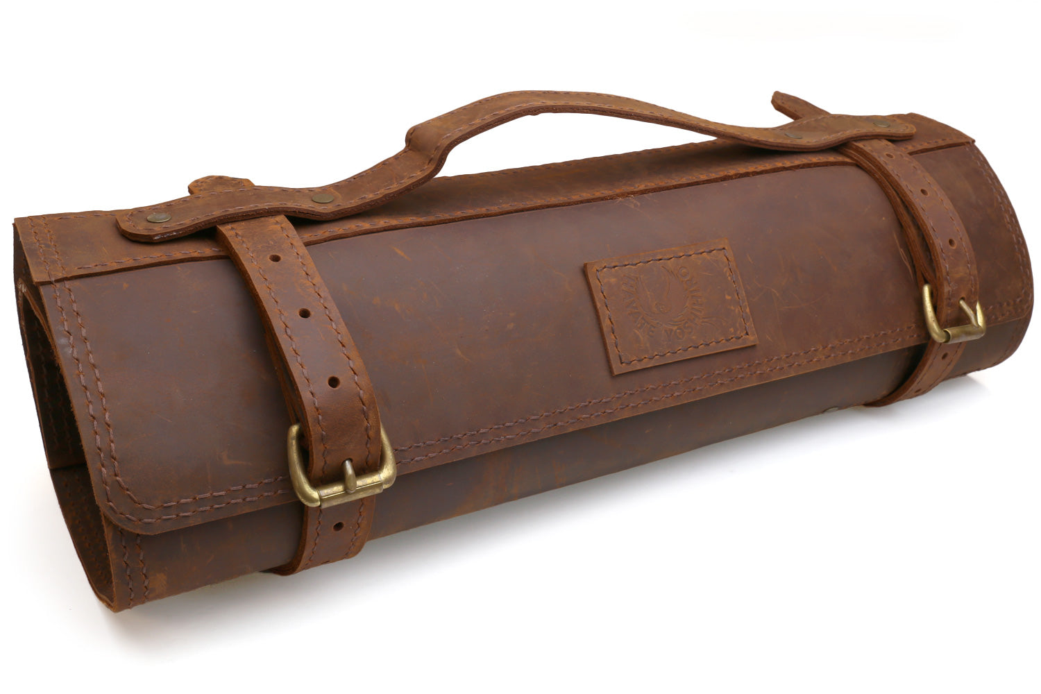 Brown natural leather knife roll bag with flap and two buckled closure straps