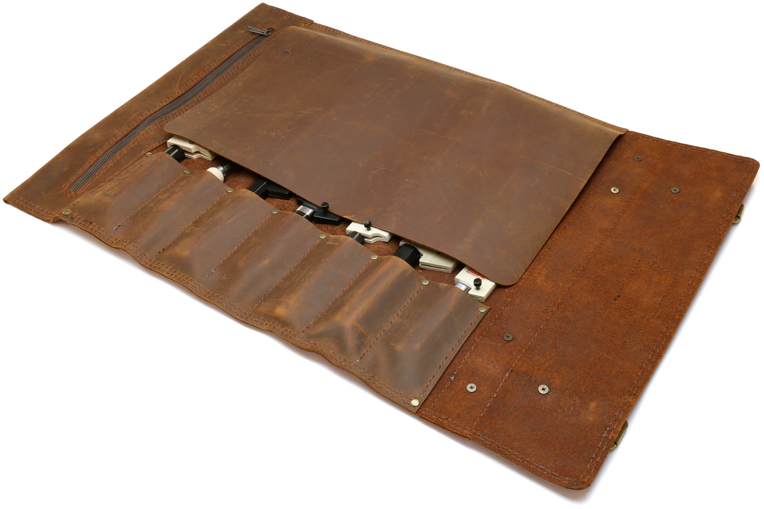Brown leather knife roll case open with knives in interior pockets and large flap