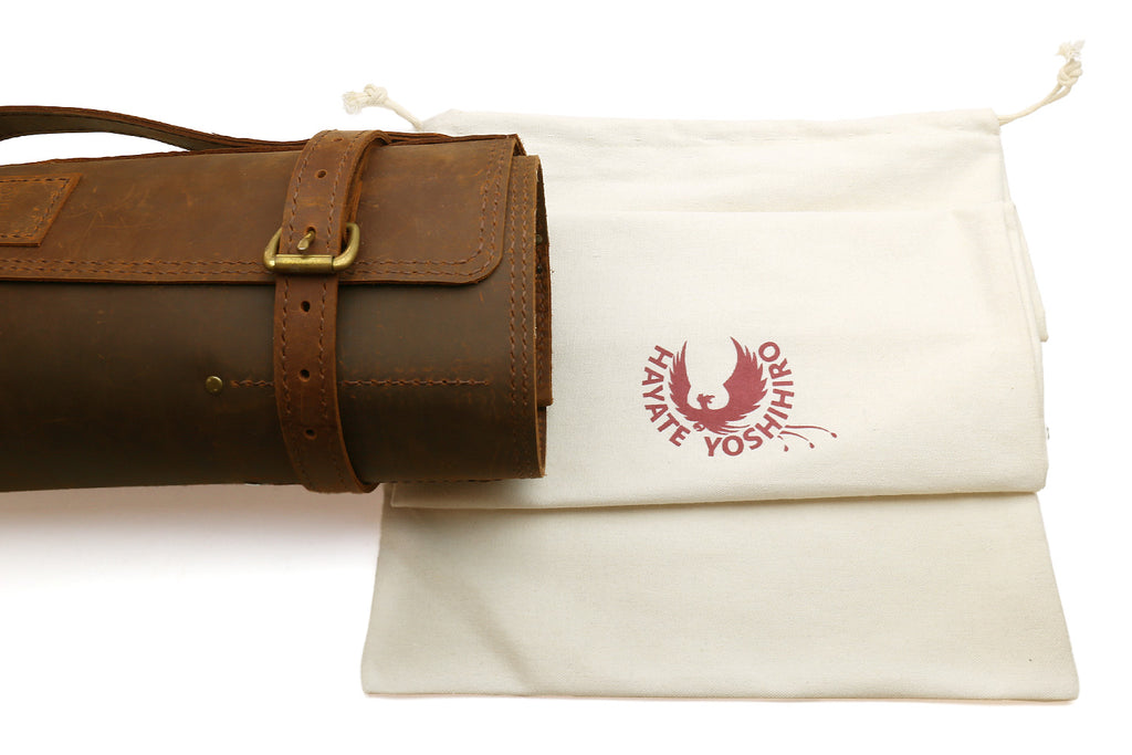 Brown natural leather knife roll storage bag with white inner cloth and wrap strap