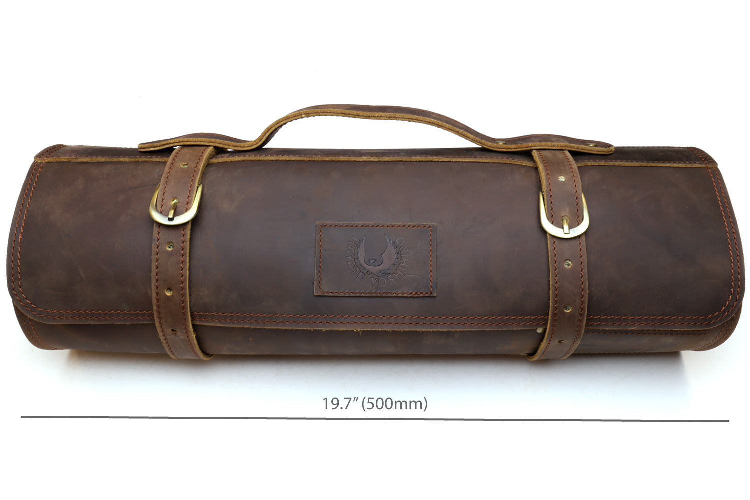 Brown leather knife roll case front view with two top handles and embossed center emblem.