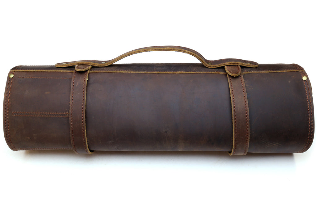 Brown cylindrical leather knife roll storage bag with carry strap and stitched trim.