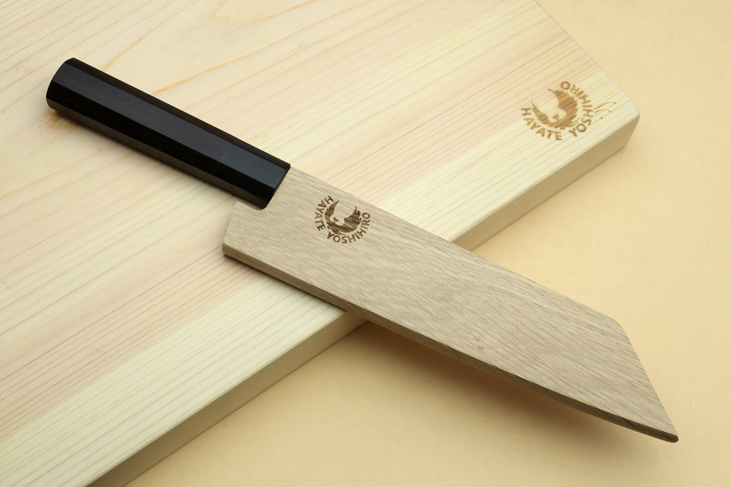 Ebony-handled utility boning knife with dark steel blade and pointed tip
