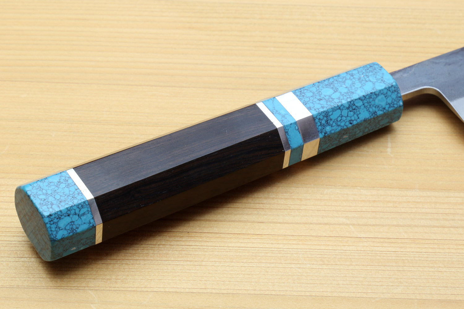 Sujihiki slicer knife with turquoise handle and dark straight blade profile