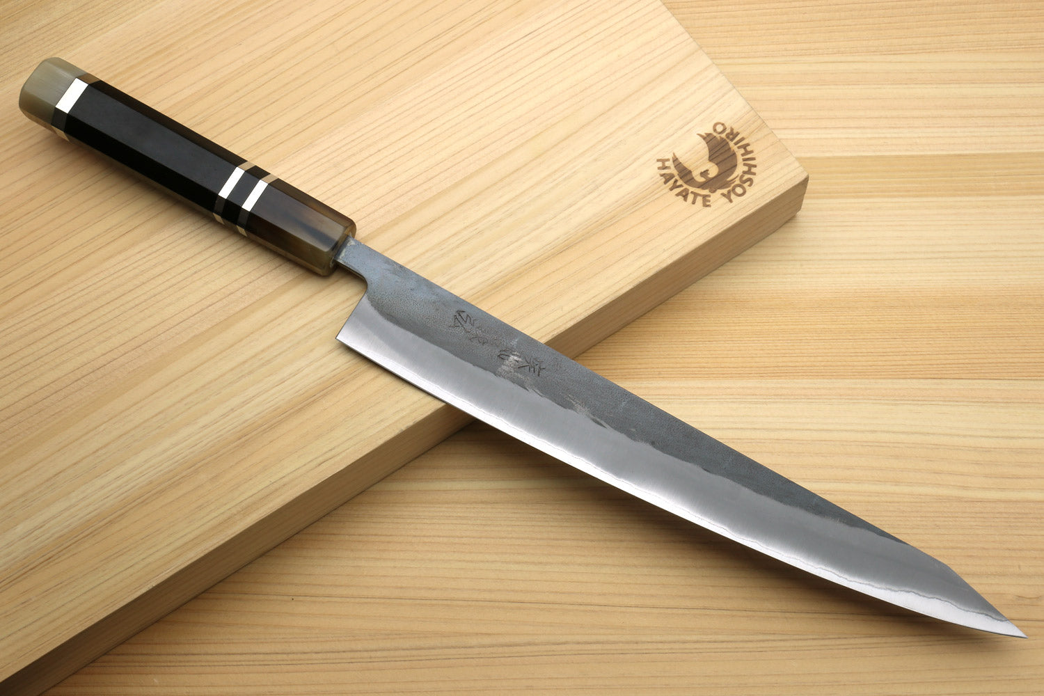 Kiritsuke slicer knife with black handle and silver blade
