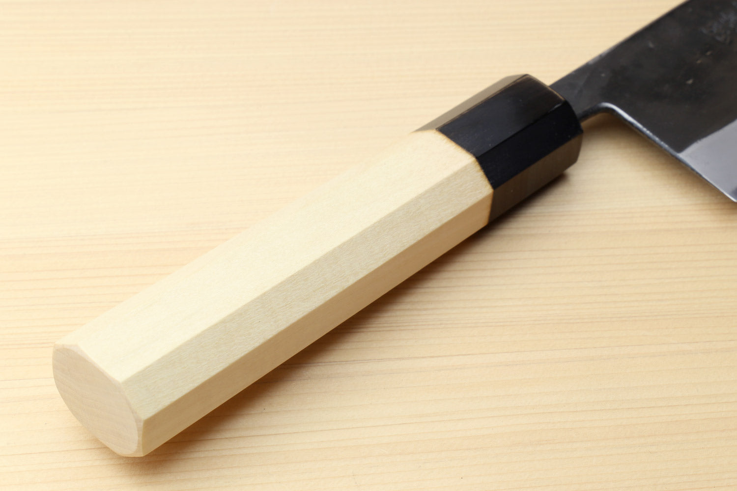 Japanese kiritsuke chef knife with light wood handle and black collar