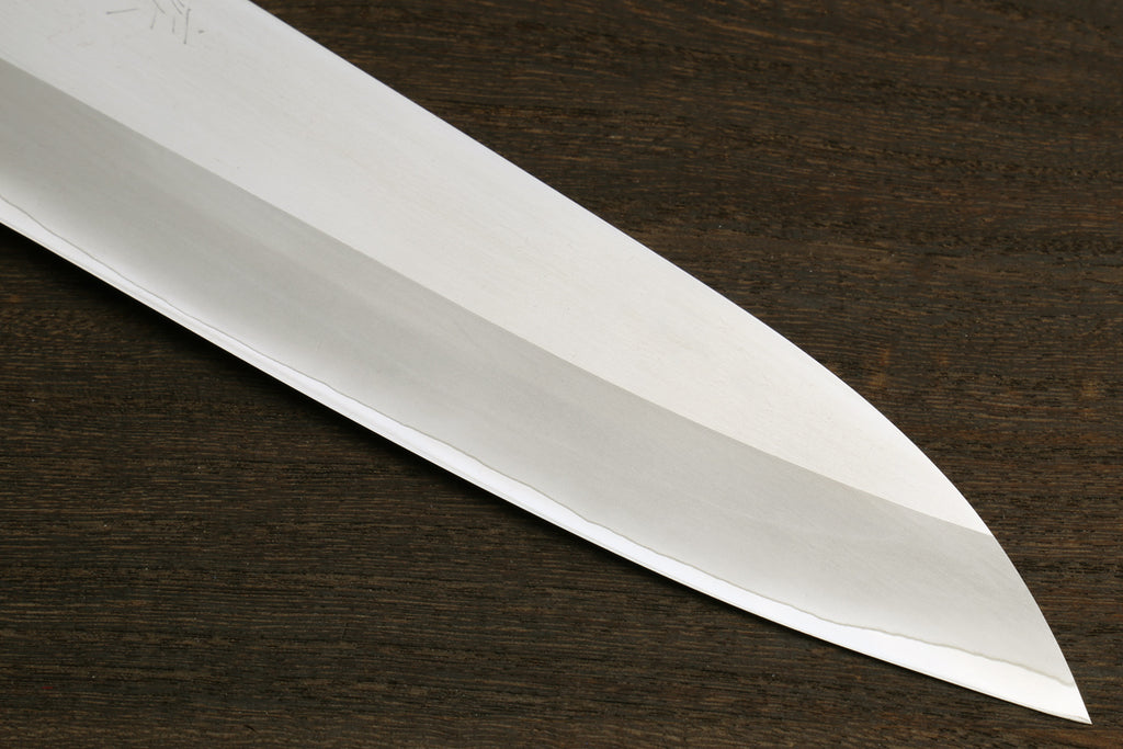 Long stainless gyuto chef knife blade with sharp pointed tip