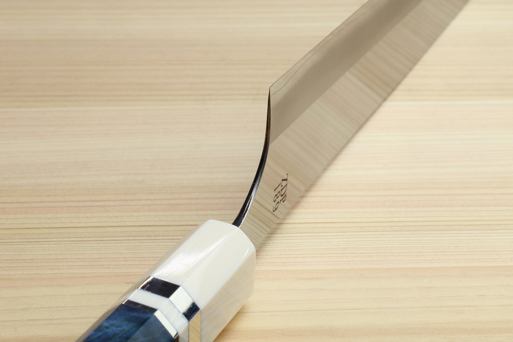 Ocean blue handle with ivory bolster and stainless blade end