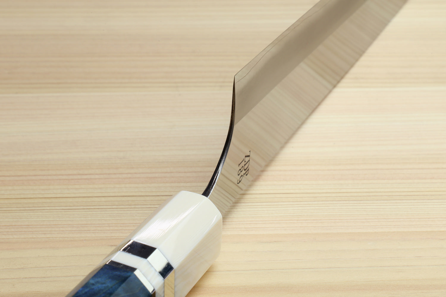 Ocean blue handle with ivory bolster and stainless blade end