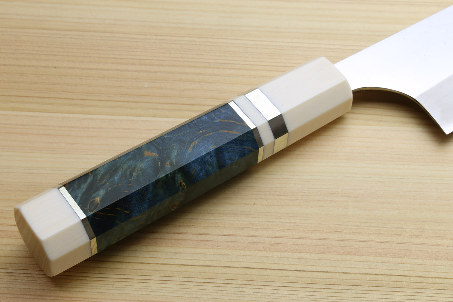 Close-up of ocean blue handle with ivory bolster and stainless blade