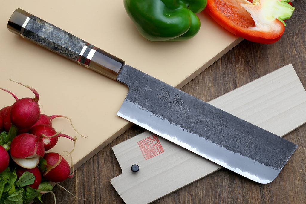 Nakiri vegetable knife with wide blade, visible tang stamp, and blue-gray patterned handle