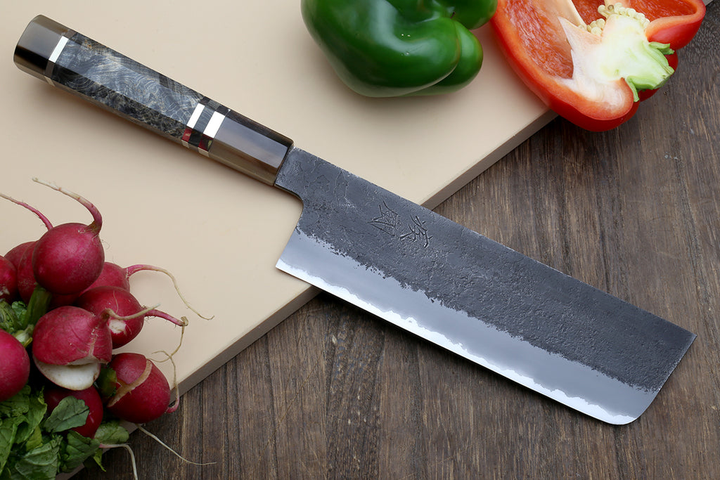 Nakiri vegetable knife side view with straight cutting edge and blue-gray handle pattern