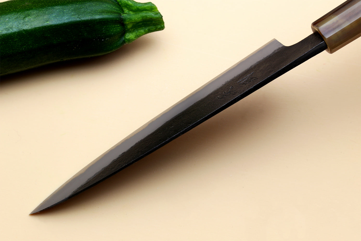 Petty utility knife with dark blue steel blade and wooden handle