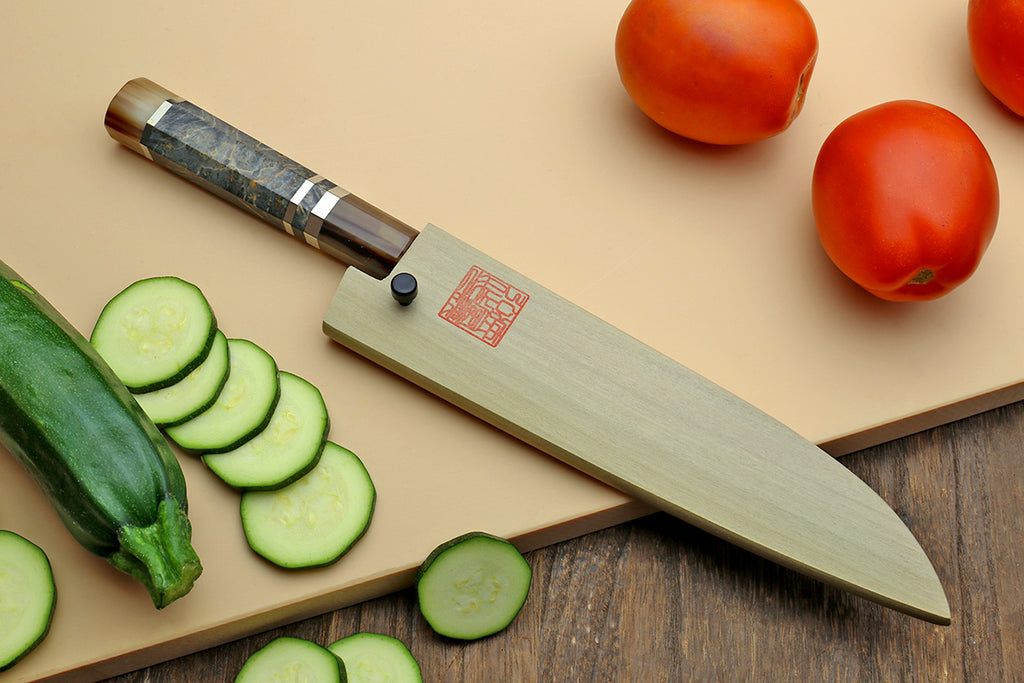 Petty utility knife with dark blue steel blade and patterned wood handle