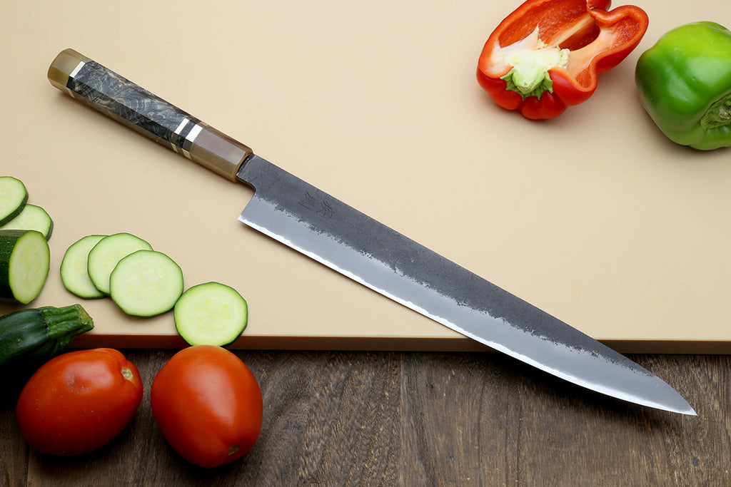 Sujihiki slicer knife with blue steel blade and faceted patterned handle