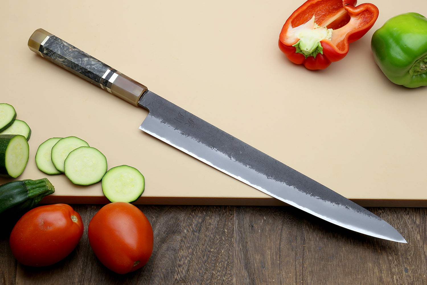 Sujihiki slicer knife with blue steel blade and faceted patterned handle