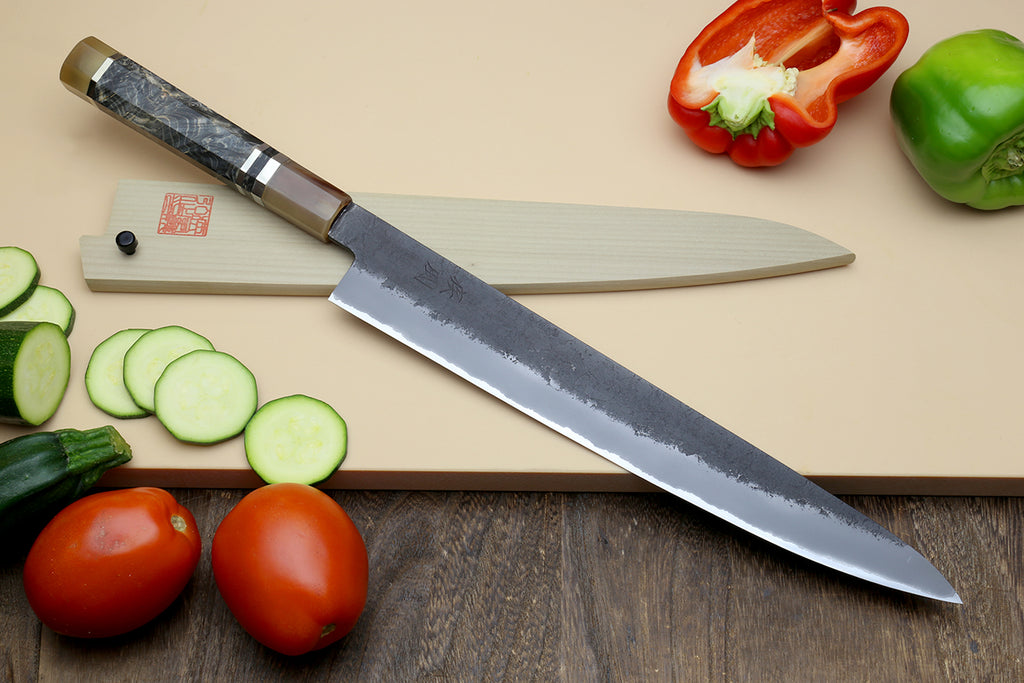 Sujihiki slicer knife, dark blue forged blade with patterned handle and heel stamp