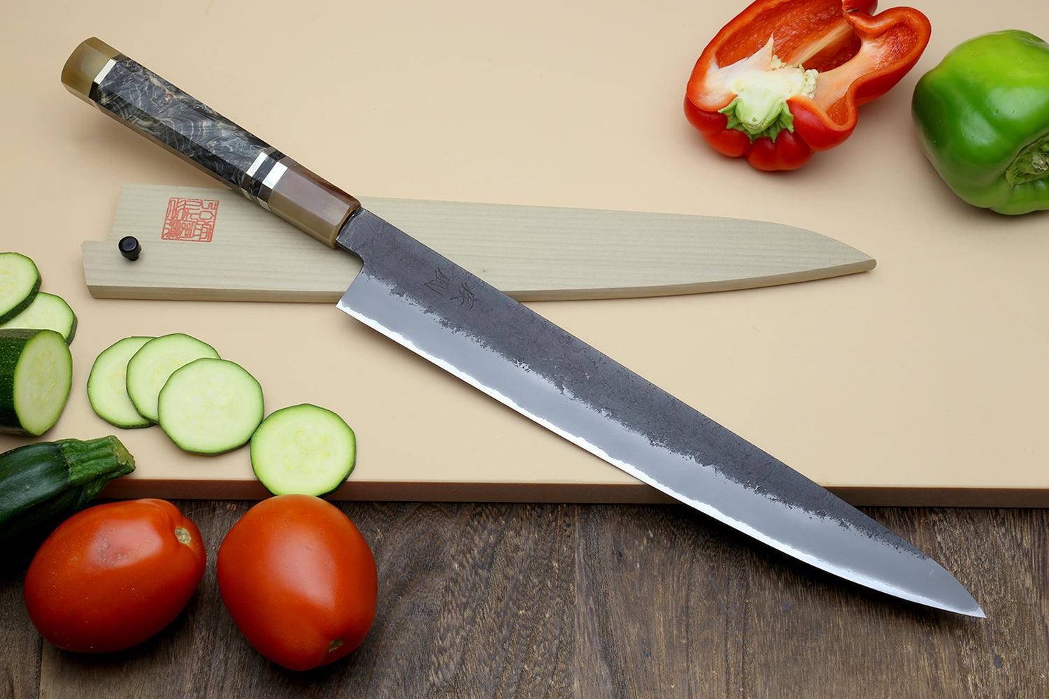 Sujihiki slicer knife, dark blue forged blade with patterned handle and heel stamp