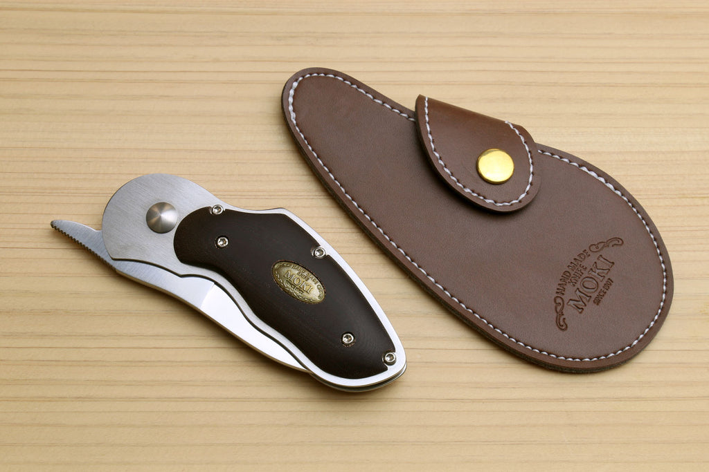 Folding pocket knife with brown leather sheath and stitched edge