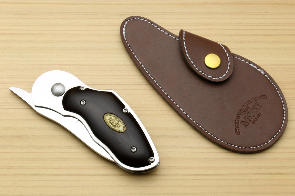 Folding pocket knife with black handle and polished blade, with brown leather sheath