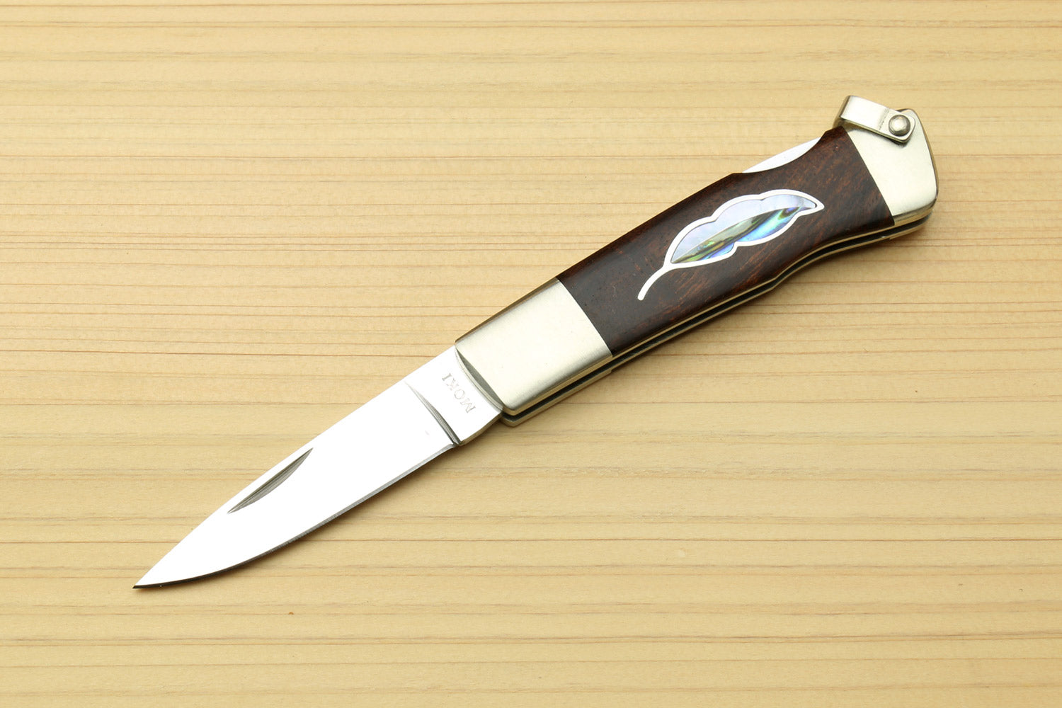 Lockback folding pocket knife with stainless blade and brown ironwood leaf inlay handle