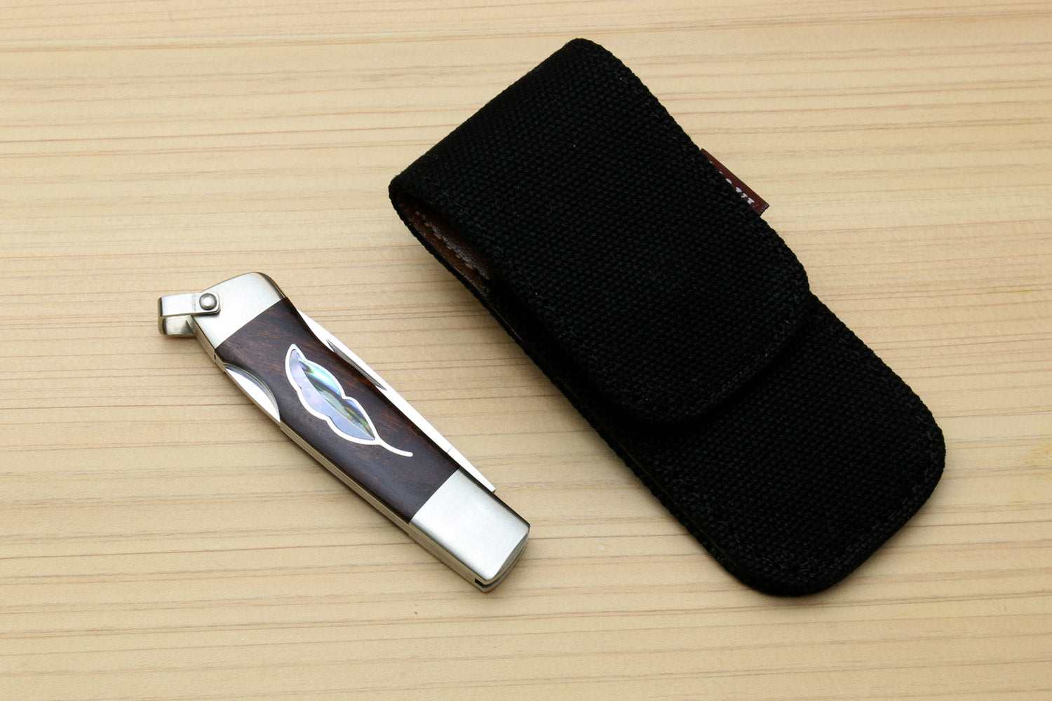 Lockback folding pocket knife with leaf inlay brown ironwood handle and black pouch