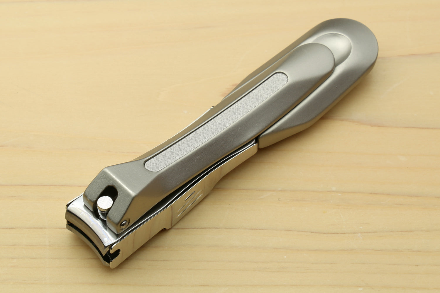 Magnetic nail clippers with silver metal body and lever handle