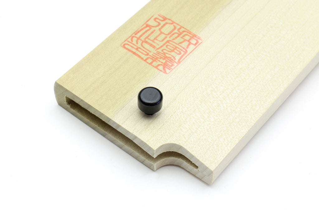 Wooden saya cover with black safety pin inserted