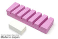 Purple sharpening stone bars with a small white conditioning stone block