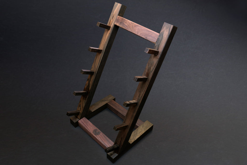Ebony and rosewood knife rack stand with open rectangle frame and side support feet
