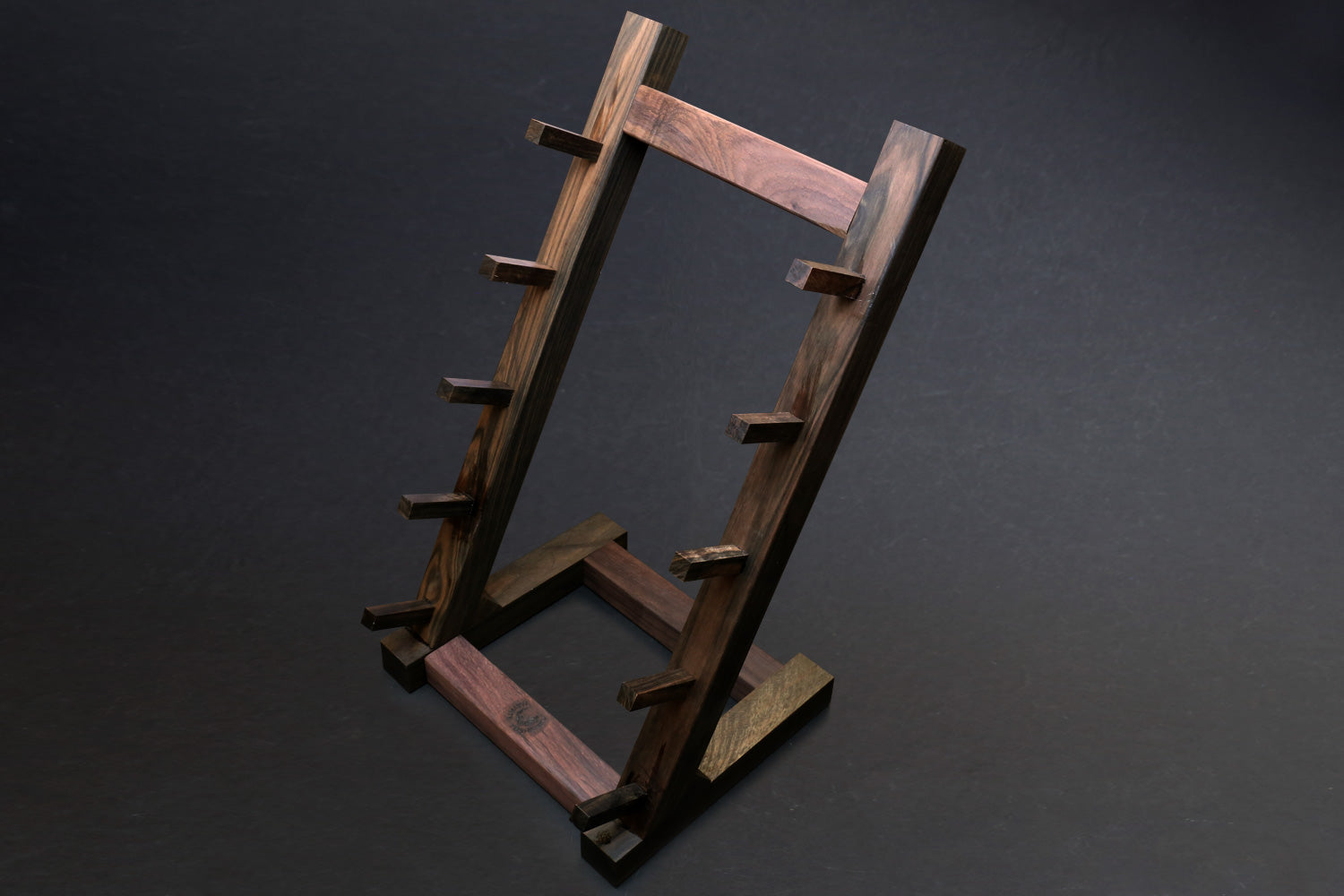 Ebony and rosewood knife rack stand with open rectangle frame and side support feet