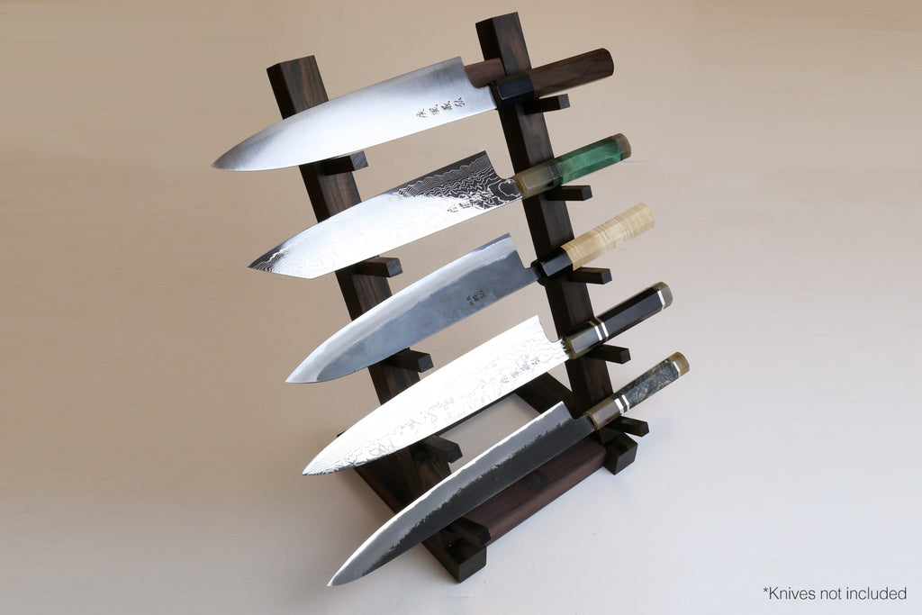 Ebony and rosewood knife rack stand with slots holding multiple kitchen knives