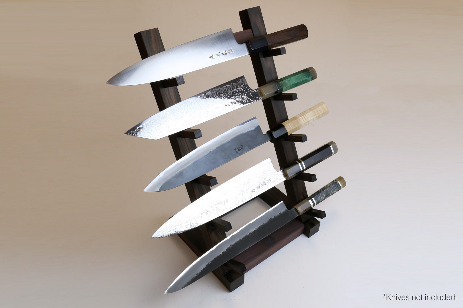 Ebony and rosewood knife rack stand with slots holding multiple kitchen knives