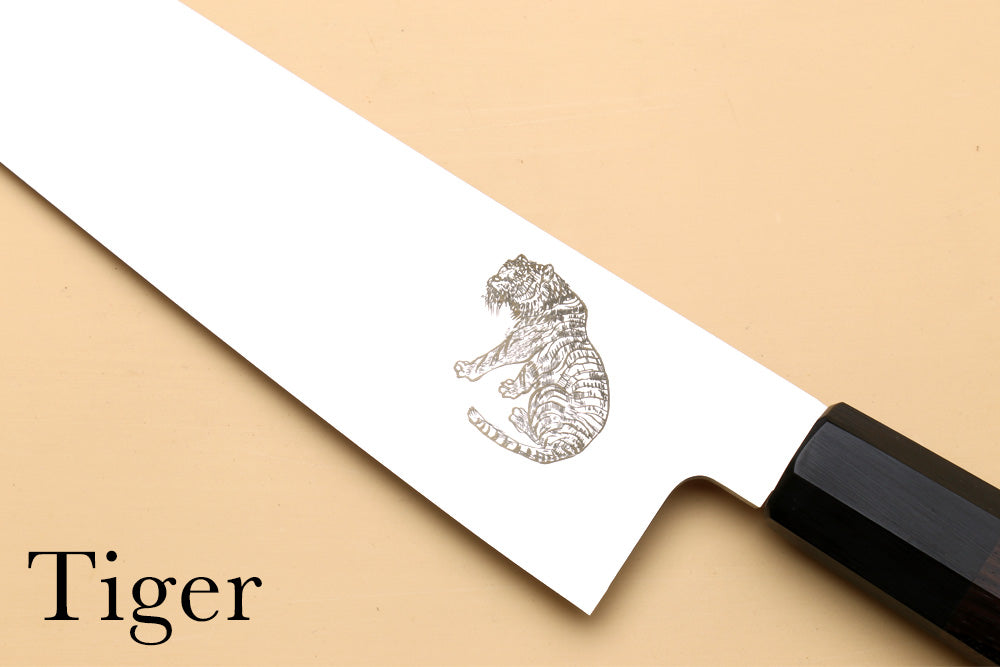 Engraved tiger emblem on white card with black handle tool