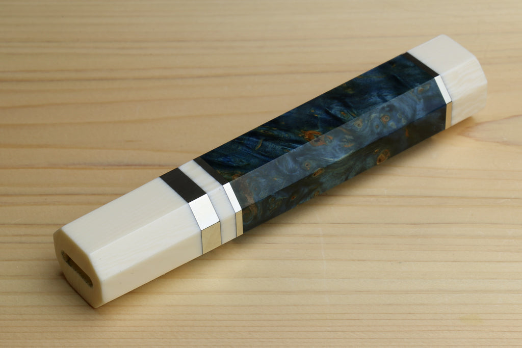 Ocean blue wrapped chef knife handle with ivory bolster and black spacer band, close view