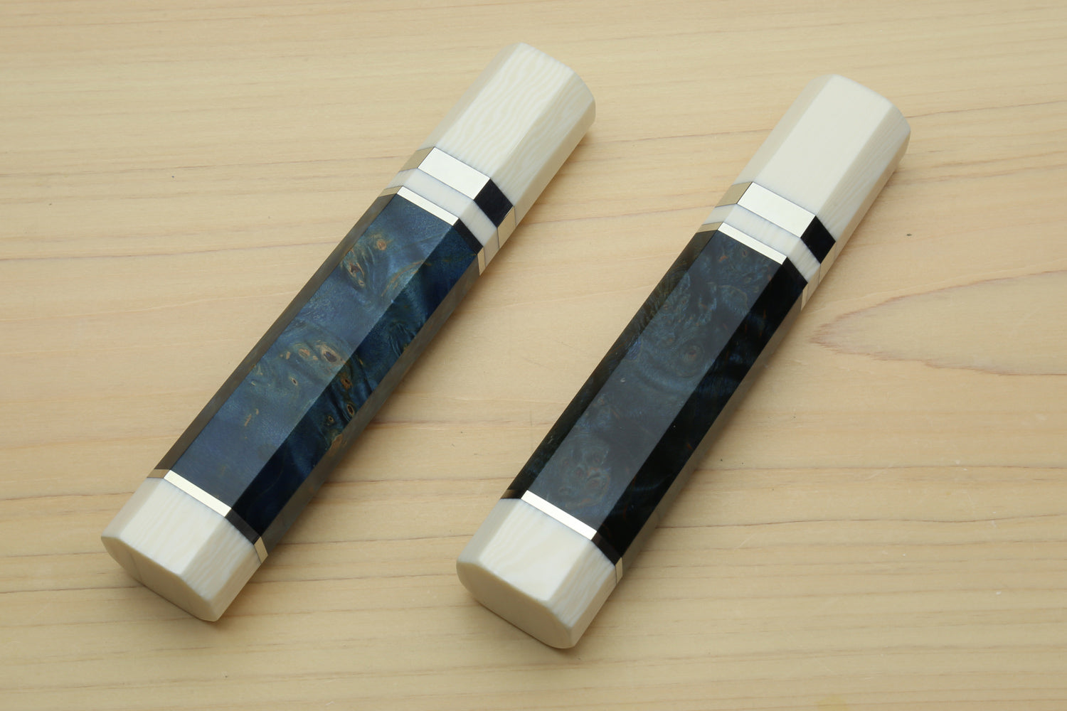Chef knife handle set with ocean blue wrap, black and ivory spacer bands, front view