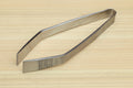Non-slip fish bone tweezers with tapered tips and textured center grip.