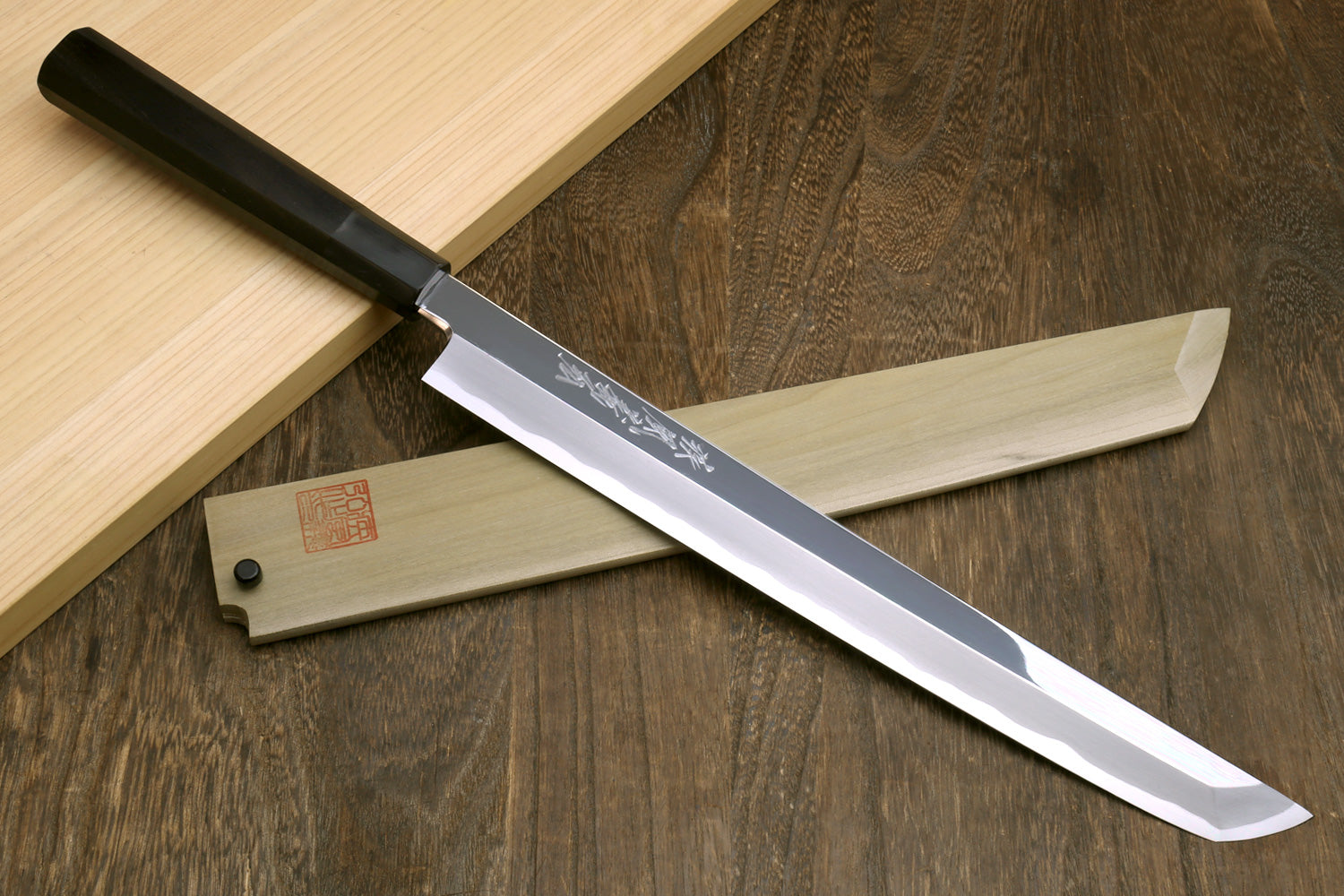 Sakimaru sushi knife with silver-polished blade and ebony handle, etched text