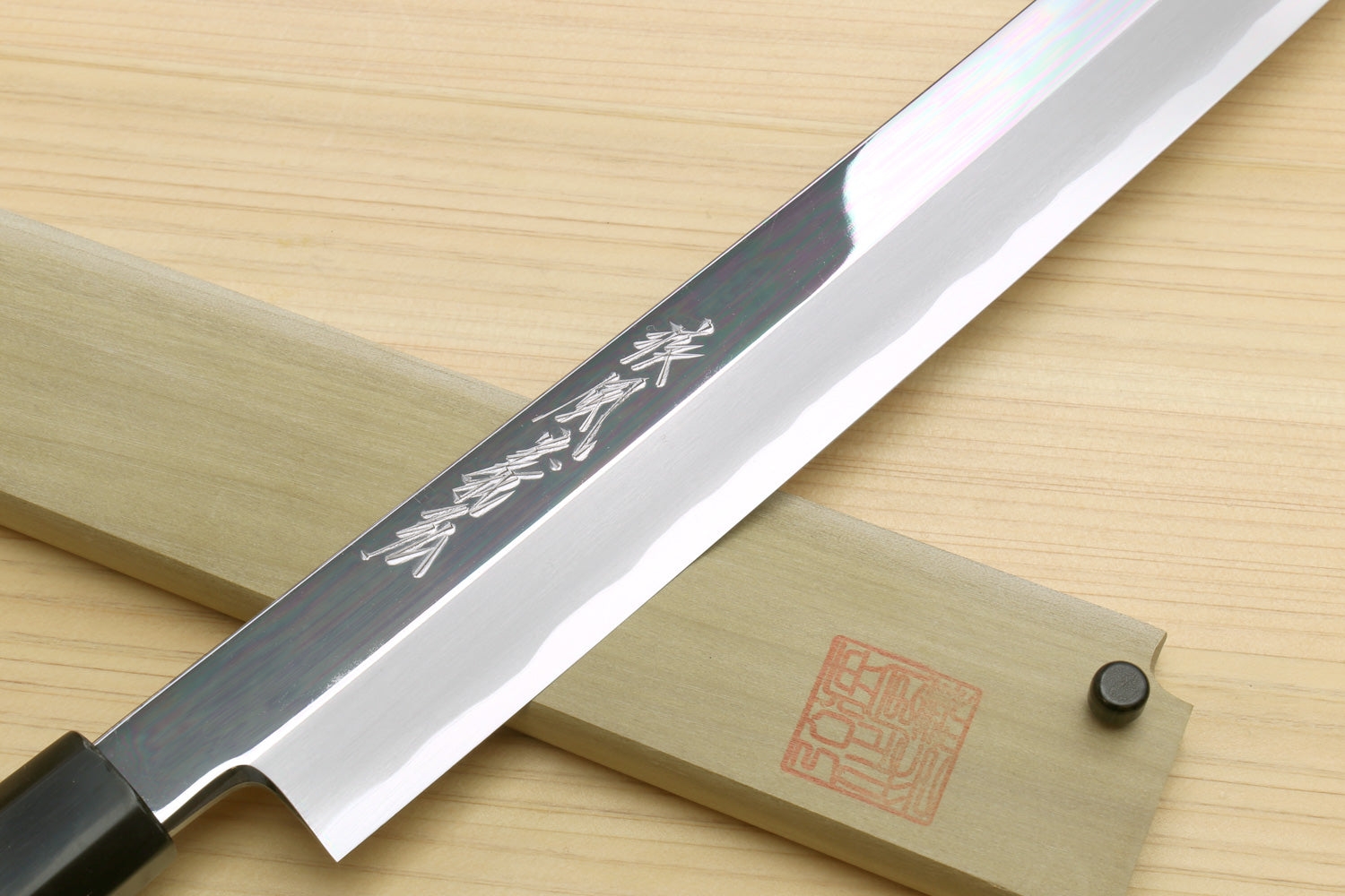 Sakimaru sushi knife with engraved blade face and polished edge, ebony handle