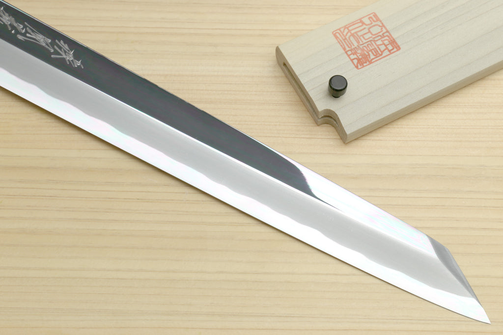 Japanese kiritsuke knife with reflective blade and black handle