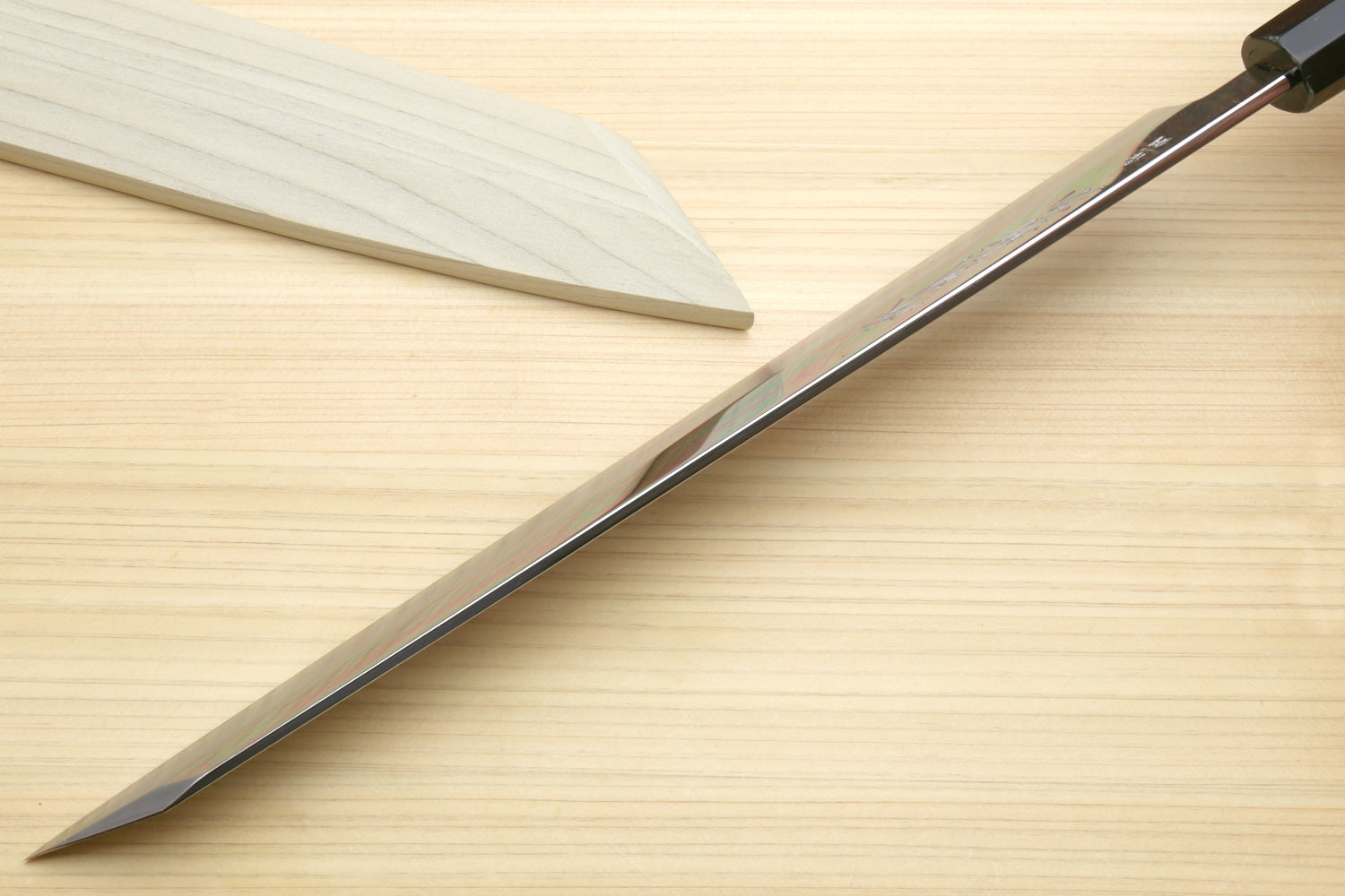 Japanese kiritsuke knife, mirror-polished tapered blade with black handle