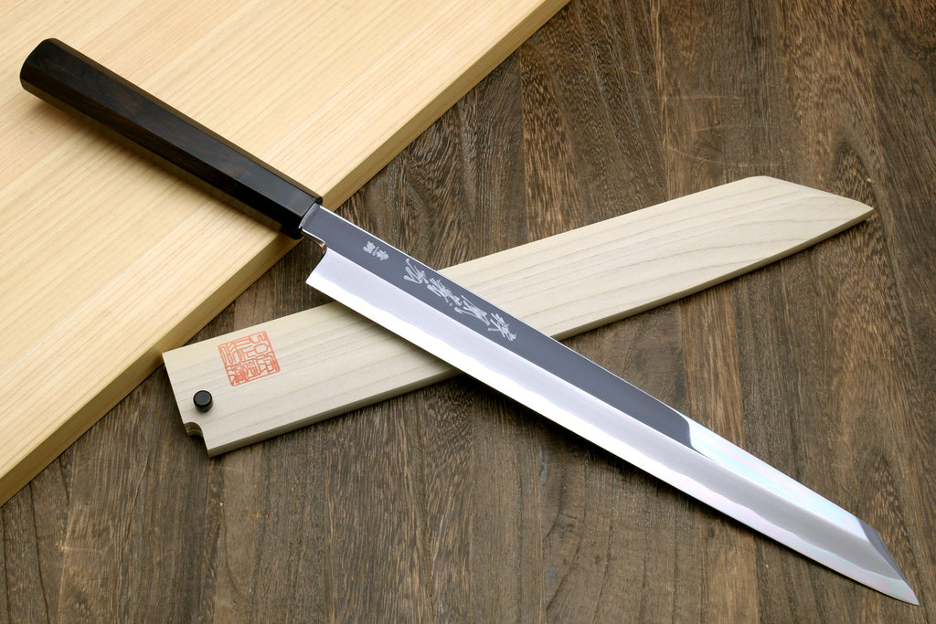 Japanese kiritsuke knife with mirror-polished blade and black ebony handle