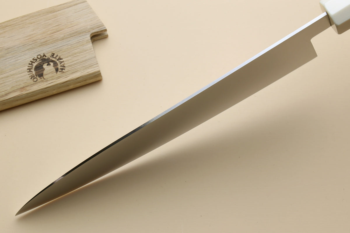 Chef knife tip and edge, stainless blade with rosewood handle and ivory bolster